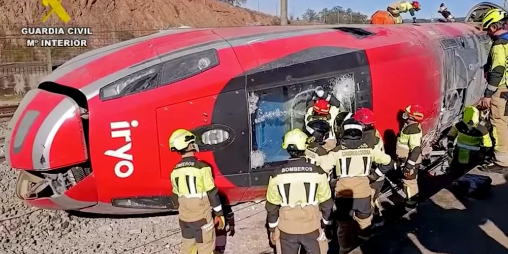 In this still image from video taken and released on January 19, 2026 by the Spain's Guardia Civil, emergency workers are seen at the site where a high-speed Iryo train derailed and was hit by another train as rescue efforts continue in Adamuz, southern Spain, on January 19, 2026. At least 39 people died and more than 120 injured in the deadliest train accident in Spain in over a decade.
The crash happened on Sunday evening when a train operated by rail company Iryo travelling from Malaga to Madrid derailed near Adamuz, crossing onto the other track where it crashed into an oncoming train, which also derailed. (Photo by Handout / Guardia Civil / AFP) / RESTRICTED TO EDITORIAL USE - MANDATORY CREDIT "AFP PHOTO / GUARDIA CIVIL" - HANDOUT - NO MARKETING NO ADVERTISING CAMPAIGNS - DISTRIBUTED AS A SERVICE TO CLIENTS