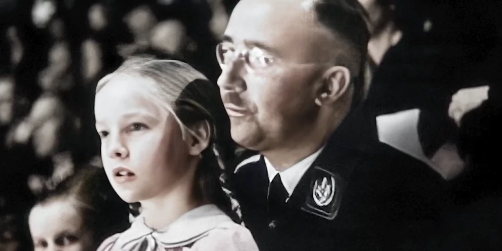 Vācijas policijas vadītājs un iekšlietu ministrs Heinrihs Himlers kopā ar meitu Gudrunu sporta pasākumā Berlīnē 1938. gada 6. martā.