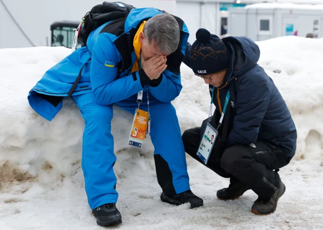 Foto, kas grauj ticību labajam: diskvalificētā olimpieša Heraskeviča tēvs-treneris salūzt kameru priekšā