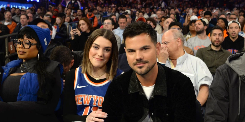 Aktieris Teilors Lautners ar sievu Teilori Doumu.