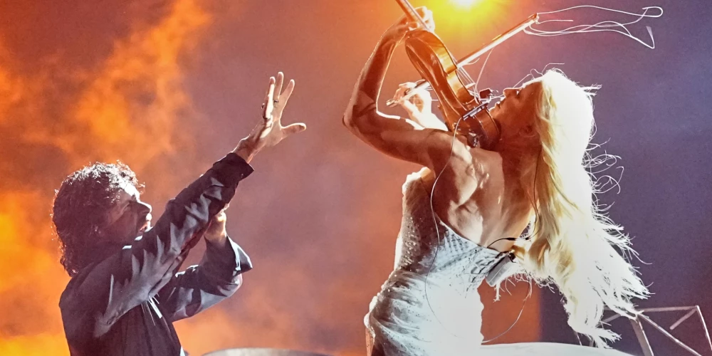 Linda Lampenius and Pete Parkkonen from Finland perform the song "Liekinheitin" during the Grand Final of the 70th Eurovision Song Contest in Vienna, Austria, Saturday, May 16, 2026. (AP Photo/Martin Meissner)