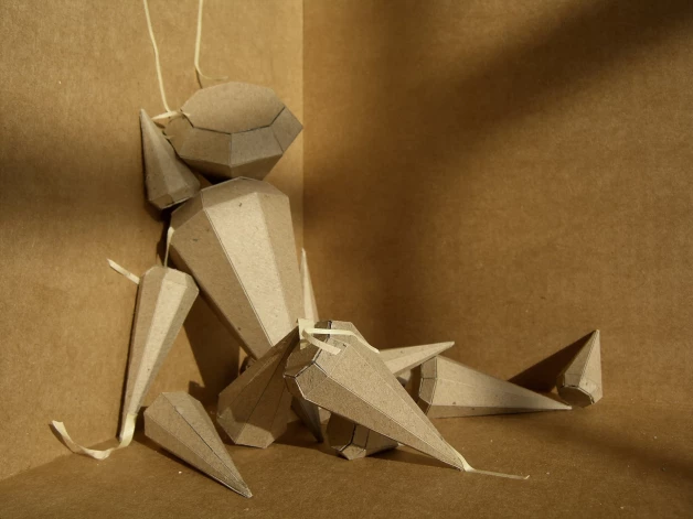 Artūrs Virtmanis, “Melanholijas ģeometrija”, kartons, papīra līmlenta, 300 x 500 x 500 cm, 2011-2026.